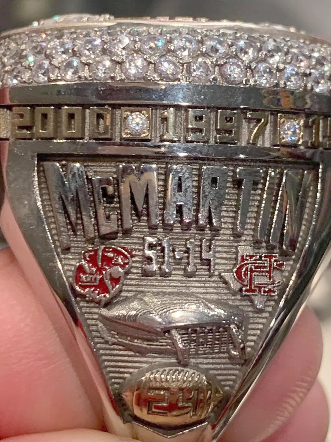 Pictured is the side of junior defensive back Hamilton McMartin’s state championship ring.